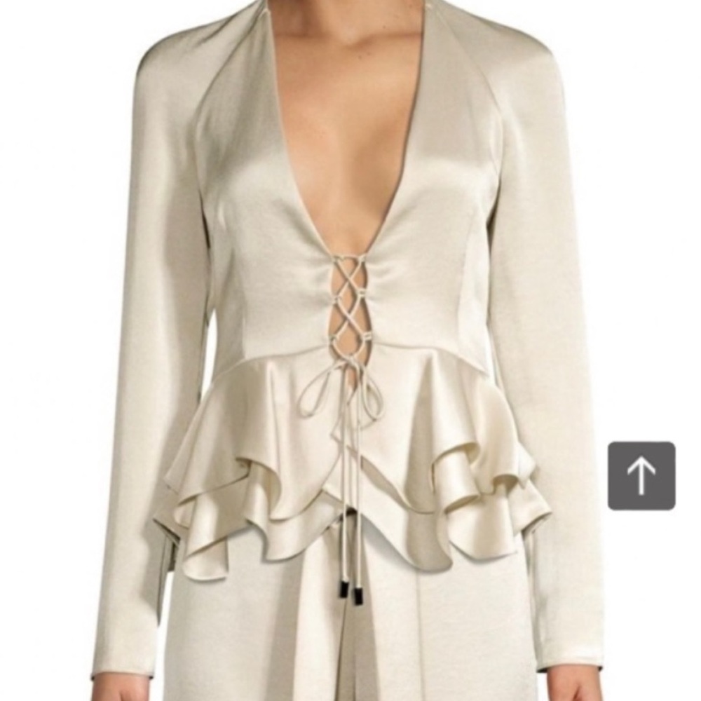 Alexis Reagan lace up peplum shiny beige top. Size medium